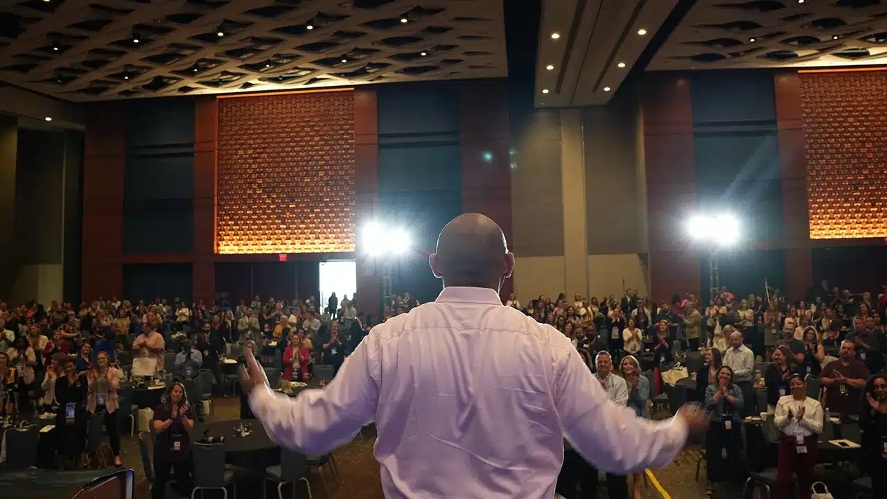 Dr. David Arrington receiving a standing ovation from a 600+ person audience